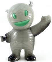 Grey Ghost Mummy Boy - NYE 10, Clear Grey w/ GID Pour, Painted  figure by Brian Flynn, produced by Super7. Front view.