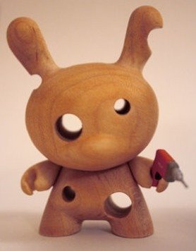DrillzAll - Exclusive Wooden Dunny Variant figure by Travis Cain, produced by Kidrobot. Front view.