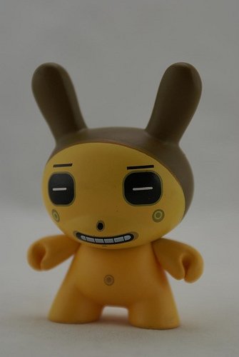 Square Eyes Yellow figure by Dalek, produced by Kidrobot. Front view.
