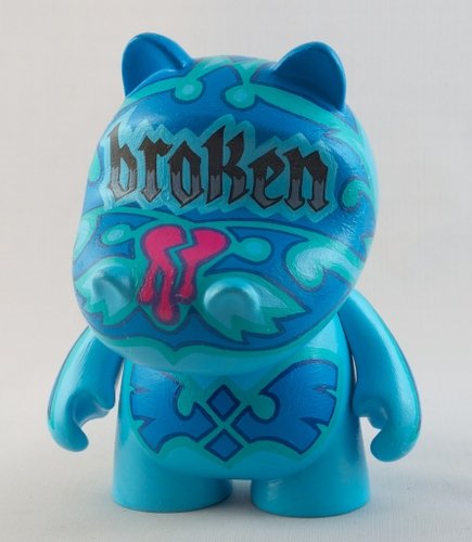 Broken figure by Emily Bee, produced by Kidrobot. Front view.